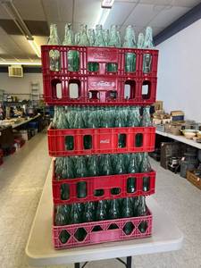 lot 64 image: Glass Coca-Cola Bottles (117) in Coca-Cola Totes