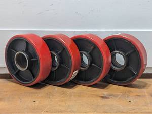 lot 71 image: Set of 4 Cast Iorn wRubber Cover Wheels - 6 x 2 - 1.75 inner Hub - ITI143180A