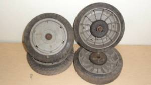 lot 78 image: Lot of 4- 8 in. Lawnmower Wheels-2 Drive  2 Dead Wheels-Used