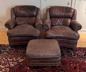 lot 8 image: Pair of Hancock and Moore Brown Leather Armchairs and Ottoman