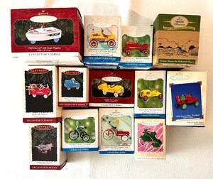lot 66 image: Collectors Series KIDDIE CAR CLASSICS HALLMARK KEEPSAKES Ornament Bundle including 1968 Murray Jolly Roger Flagship