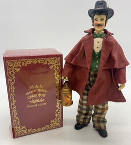 lot 41 image: Vintage DEPT 56 Possible Dreams Clothtique The Christmas Caroler Figurine and New Charles Dickens Bound Book Set 