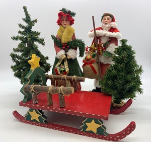 lot 34 image: 2 Vintage MR. & MRS. CLAUS Wood Figurines with Wood Sled and 2 Trees