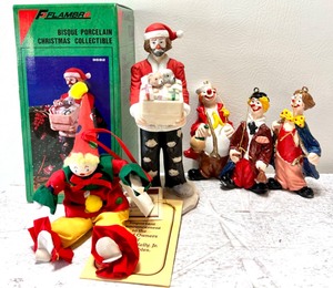 lot 248 image: Jolly Holiday Clown Lot of Fun THE EMMETT KELLY Jr. Signature Collection Christmas Collectable #9692 Bisque Porcelain Figure by FLAMBRO with other Plastic and Fabric Ornaments