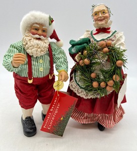 lot 442 image: CLOTHTIQUE Santa and Mrs Claus Figurines