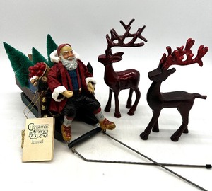 lot 517 image: CHRISTMAS IN AMERICA Santa in Sleigh and Two Metal Reindeer