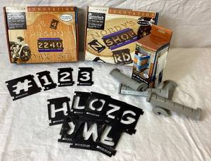 lot 56 image: Rockler Sign Maker Templates 29 pc Numbers and Symbols, 41 pc Letter Set and 38 Box Joint Cauls