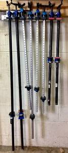 lot 62 image: 8 Rockler Woodworking Clamps and Pipe Clamp Rack