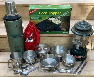 lot 71 image: Camping Collection - Coleman Lantern, Stanley 2 QT Thermos, Corn Popper and Coleman Cooking Bundle