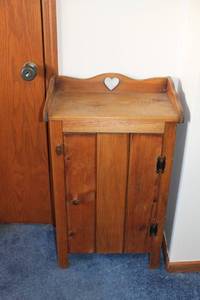 lot 33 image: Vintage Wooden Cabinet with Heart Cutout Design