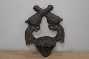 lot 213 image: Cast Iron Crossed Pistols Wall Bottle Opener