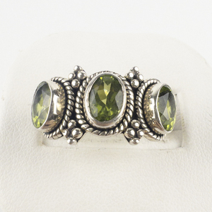 lot 108 image: Doug Paulus  Oval Cut Peridot  Sterling Silver Ring. Size 8 - 8.25.