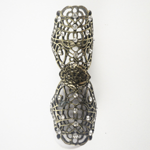 lot 134 image: Rhinestone Accented Open Work Base Metal Full Finger Ring . Size 7 But Has Ability To Stretch .