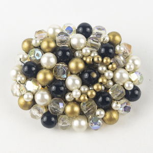 lot 235 image: Gold, White, & Black Beaded Gold Tone Base Metal Brooch .