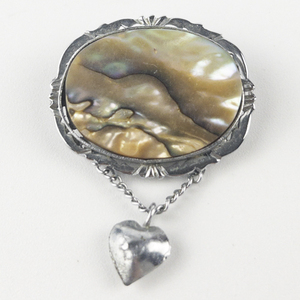 lot 247 image: With Dangling Puff Heart Base Metal Brooch .