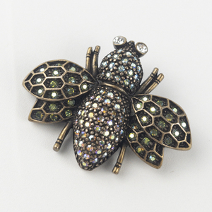 lot 259 image: Kirks Folly Aurora Borealis Antiqued Base Metal Brooch .