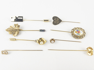 lot 263 image: Group of 8 Base Metal Stick Pins.