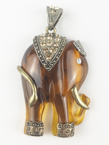 lot 94 image: Large CZ Accented Simulated Amber Elephant base metal pendant (no chain).