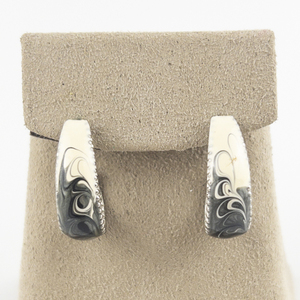 lot 181 image: Black & White Enamel Swirl Silver Tone Base Metal Half-Hoop Pierced Earrings.