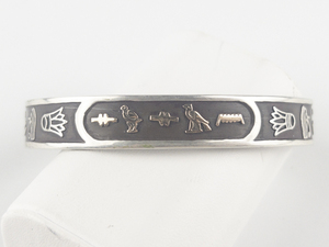 lot 267 image: Egyptian Cartouche Spells Suzanne In Hieroglyphicsrose &Sterling Silver Cuff Bracelet. Possibly Karat Gold Letters