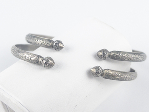 lot 280 image: Set of two  Vintage Floral Patterned Silver Cuff Bracelets.