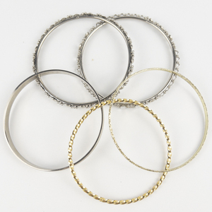 lot 296 image: Set of five  Textured Yellow & White Base Metal Bangles.