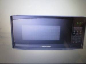 lot 108 image: Chefman 0.7 cu. ft. Microwave Oven ...