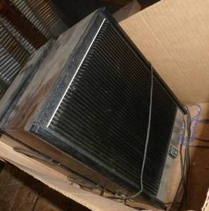 lot 14 image: Two garage speakers and a GE clock radio