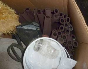 lot 34 image: big box of stuff - heated bird bath, car vac, floor cleaner, foam pieces like what are on bike handles, pipe insulation