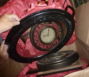 lot 89 image: Box of dcor items, mirror, clock, pictures, flower planter box with clippers