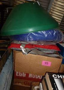 lot 95 image: Xmas tree stand, chair cushion, kids life jacket, box of fishing books, ice cube trays, corner shelf