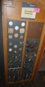 lot 112 image: Hardware store display of new drawer knobs and pulls