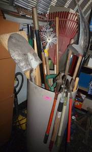 lot 152 image: Barrel full of tools - clippers, shovels, rakes etc