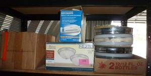 lot 158 image: shelf of light fixtures, paper shredder and box of kids books