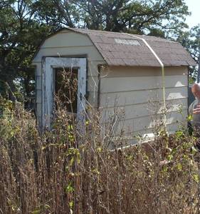 lot 208 image: small shed 4 ft wide x 8 ft wide x 7 ft tall - does not include trailer