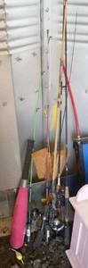 lot 217 image: group of fishing poles and a baseball bat
