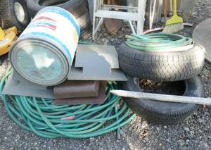 lot 259 image: pile of garden hose, roof vents, 2 tires