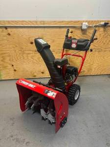 lot 7 image: TROY-BILT Storm 24 in. 208 cc Two- Stage Gas Snow Blower with Electric Start Self Propelled