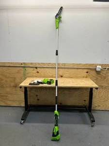lot 69 image: Greenworks 40V 8-inch Cordless Polesaw, 2.0Ah Battery and Charger Included