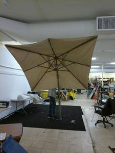 lot 105 image: Beige Patio Umbrella with Metal Stand