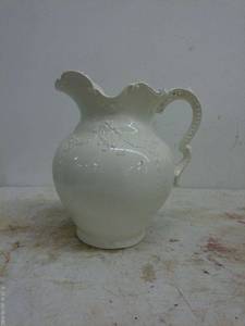 lot 149 image: Vintage White Ceramic Pitcher with Embossed Design