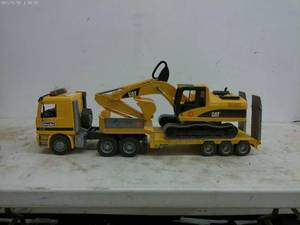 lot 180 image: Toy CAT Excavator and Lowboy Truck Set