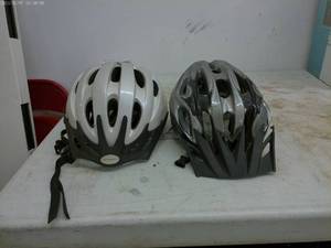 lot 202 image: pair of gently used bike helmets