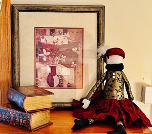 lot 145 image: Shades of Red Home Decor Including Fancy Doll, Petite Art, Candles, Book Box Decor