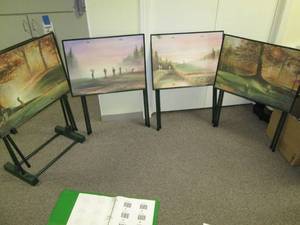 lot 47 image: Rack of 4 golf theme TV trays...