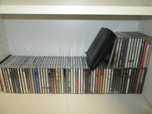 lot 85 image: Shelf filled with CDs...