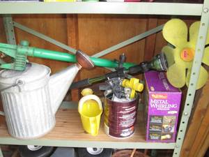 lot 89 image: Shelf of yard sprinklers and more...