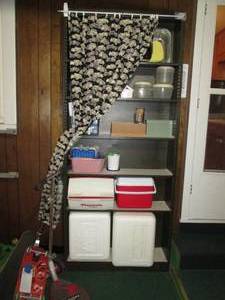 lot 235 image: Metal garage shelf 7 tall contents...