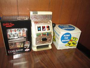 lot 192 image: Miniature slot machines and coin ba...