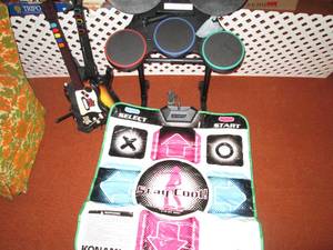 lot 204 image: Guitar hero set with drums and a Pl...